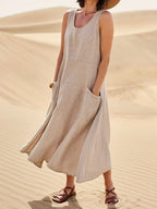Cotton women's dress featuring a relaxed fit, stylish pockets, and a comfortable design, perfect for casual outings or everyday wear. 0