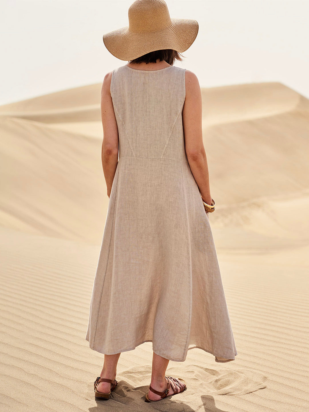 Cotton women's dress featuring a relaxed fit, stylish pockets, and a comfortable design, perfect for casual outings or everyday wear. 1