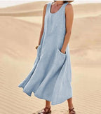 Cotton women's dress featuring a relaxed fit, stylish pockets, and a comfortable design, perfect for casual outings or everyday wear. 13