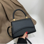 Stylish PU leather handbag featuring a top handle and a detachable crossbody strap, perfect for versatile wear and everyday use. 0