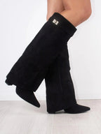 Knee high boots with a stylish flared top and comfortable block heel, perfect for fashionable fall and winter outfits. 3