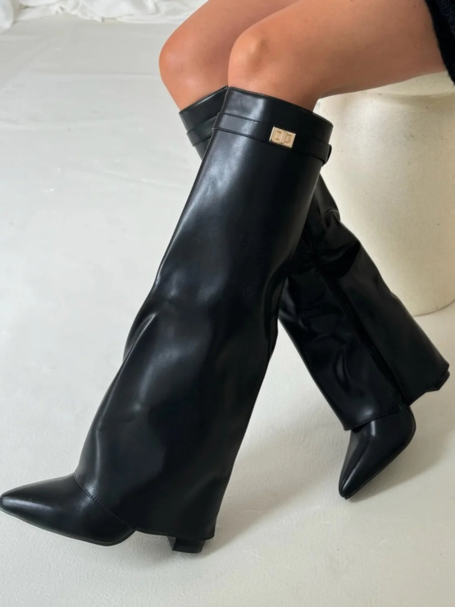 Knee high boots with a stylish flared top and comfortable block heel, perfect for fashionable fall and winter outfits. 9