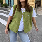 Lambswool vest with button front in slim fit, showcasing a stylish design and cozy texture, perfect for layering in cooler weather. 1