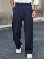 Loose-fitting wide leg trousers featuring stylish pleats and a double waistband, perfect for a comfortable yet fashionable look. 0