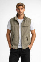 Men's lightweight vest featuring zippered pockets and a structured collar, ideal for outdoor activities and casual wear. 0
