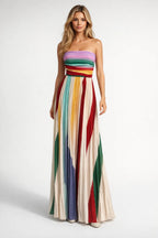 Strapless maxi dress featuring a flowy silhouette, perfect for summer weddings, in a vibrant floral print. 0