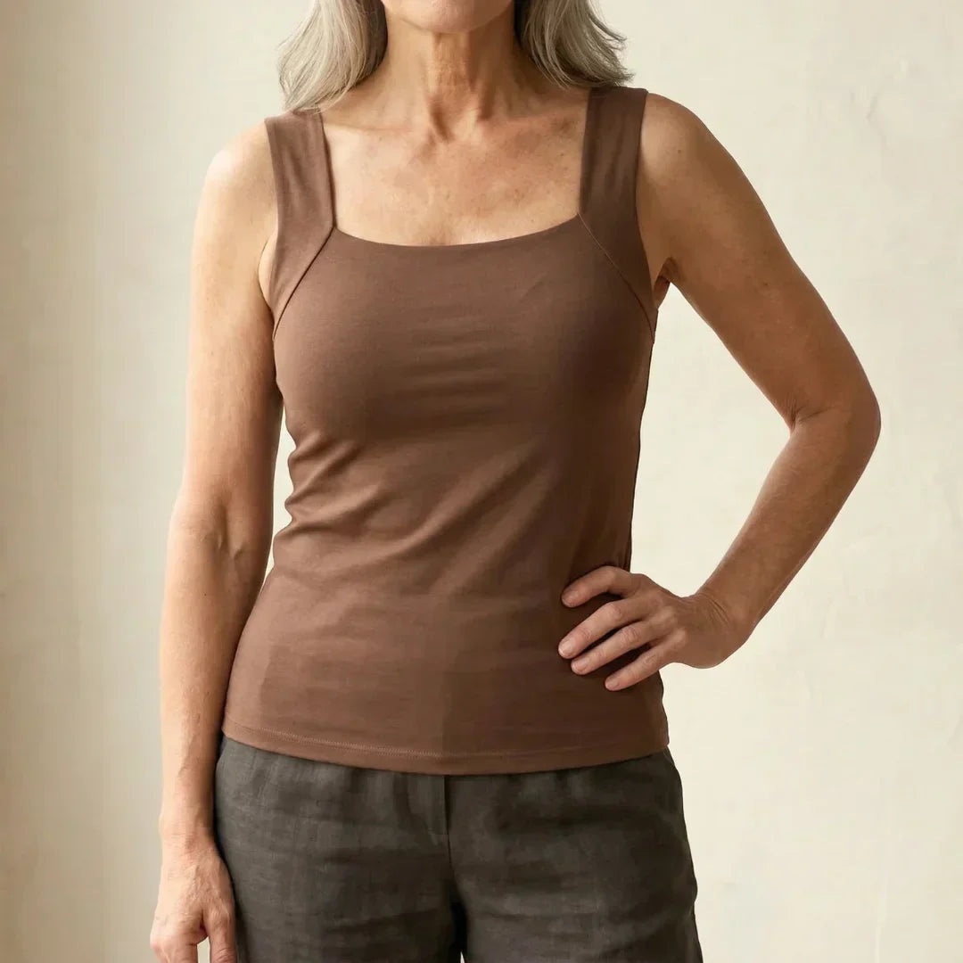 Women’s tank top featuring a built-in bra, designed with breathable fabric for ultimate comfort and support during workouts or casual wear. 1