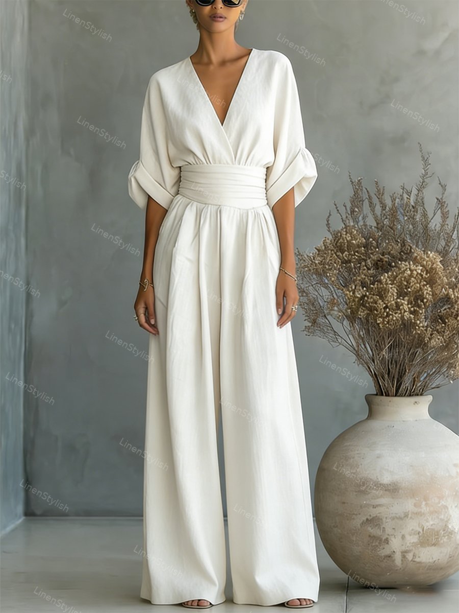 V-Neck jumpsuit for women featuring a tailored fit and luxurious silk-touch fabric, perfect for elegant occasions and stylish outings. 0