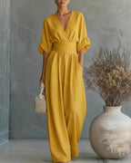 V-Neck jumpsuit for women featuring a tailored fit and luxurious silk-touch fabric, perfect for elegant occasions and stylish outings. 11