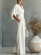 V-Neck jumpsuit for women featuring a tailored fit and luxurious silk-touch fabric, perfect for elegant occasions and stylish outings. 5