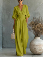 V-Neck jumpsuit for women featuring a tailored fit and luxurious silk-touch fabric, perfect for elegant occasions and stylish outings. 6