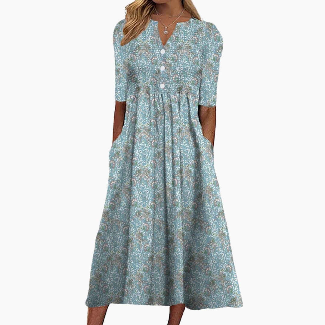 Women's A-line midi dress featuring a vibrant floral print, perfect for summer outings in warm weather. 0