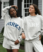 Women's oversized sweatshirt featuring soft chenille lettering, perfect for casual everyday wear and stylish comfort. 10