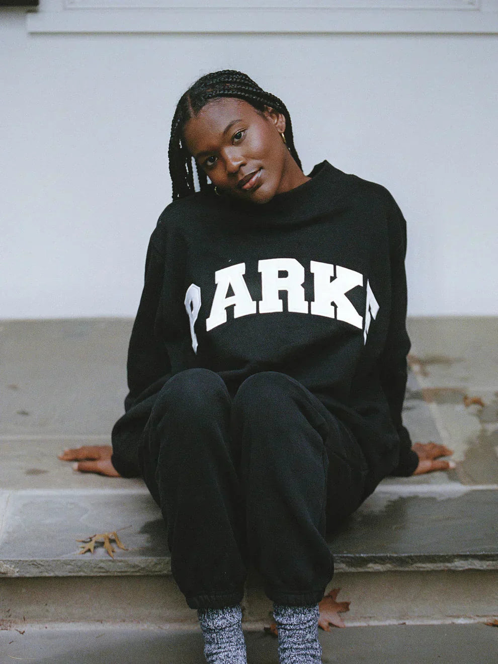 Women's oversized sweatshirt featuring soft chenille lettering, perfect for casual everyday wear and stylish comfort. 12