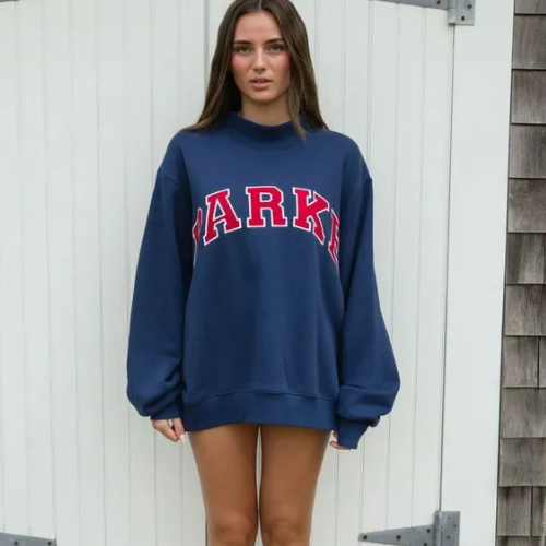 Women's oversized sweatshirt featuring soft chenille lettering, perfect for casual everyday wear and stylish comfort. 6