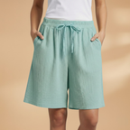 Women's relaxed fit knee-length shorts in a stylish design, perfect for casual outings and summer wear. 14