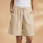 Women's relaxed fit knee-length shorts in a stylish design, perfect for casual outings and summer wear. 17