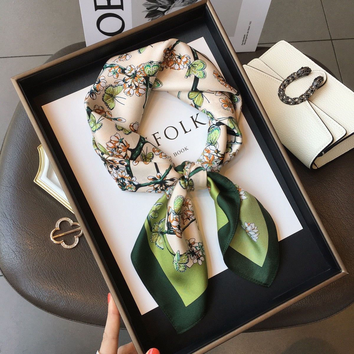 Women's square silk scarf featuring a luxurious design, ideal for versatile styling and elegant occasions, showcasing vibrant colors and a smooth texture. 0